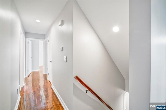 132 Hiawatha Blvd, Oakland, NJ 07436 - hall with an upstairs landing, wood finished floors, recessed lighting, and baseboards