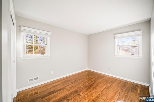 132 Hiawatha Blvd, Oakland, NJ 07436 - empty room featuring baseboards, healthy amount of natural light, and wood finished floors