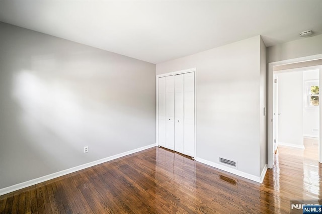132 Hiawatha Blvd, Oakland, NJ 07436 - unfurnished bedroom featuring baseboards, wood finished floors, and a closet