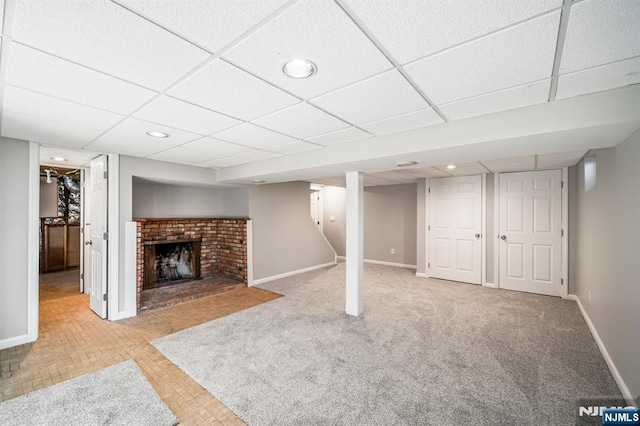 132 Hiawatha Blvd, Oakland, NJ 07436 - finished below grade area featuring baseboards, a drop ceiling, carpet flooring, recessed lighting, and a fireplace