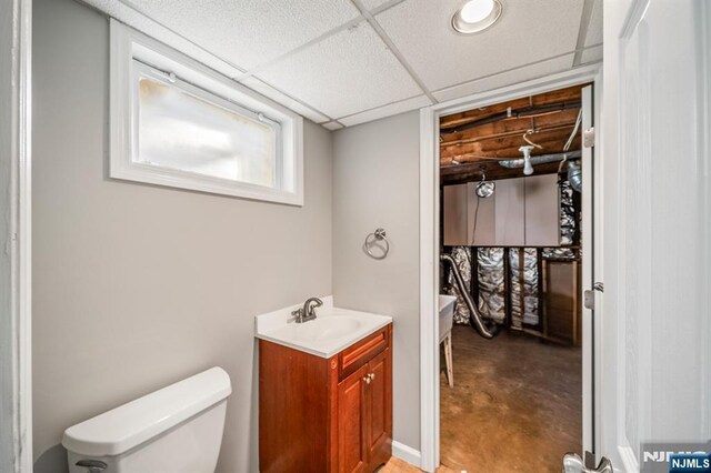 132 Hiawatha Blvd, Oakland, NJ 07436 - bathroom featuring toilet, vanity, a drop ceiling, and concrete floors
