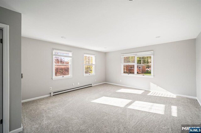 132 Hiawatha Blvd, Oakland, NJ 07436 - unfurnished room with a baseboard heating unit, carpet flooring, and baseboards