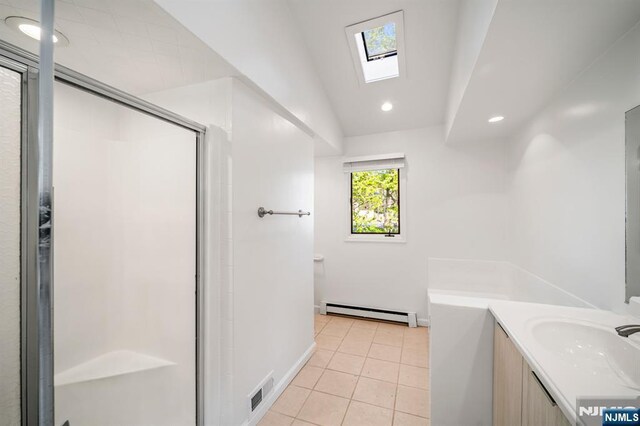 132 Hiawatha Blvd, Oakland, NJ 07436 - full bath with a skylight, a baseboard heating unit, tile patterned flooring, a stall shower, and recessed lighting
