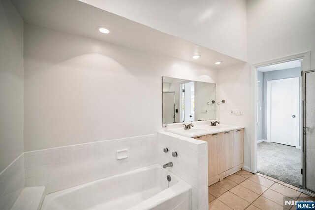 132 Hiawatha Blvd, Oakland, NJ 07436 - full bath with a bath, tile patterned flooring, double vanity, and recessed lighting