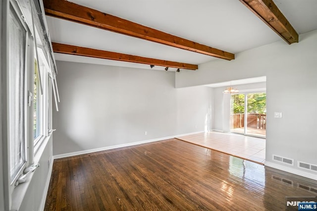 132 Hiawatha Blvd, Oakland, NJ 07436 - empty room with a chandelier, hardwood / wood-style floors, beamed ceiling, and baseboards