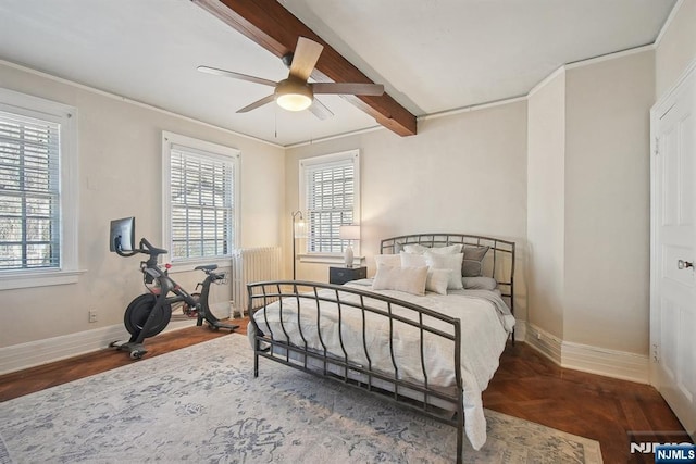 bedroom featuring baseboards, ornamental molding, beam ceiling, ceiling fan, and radiator heating unit