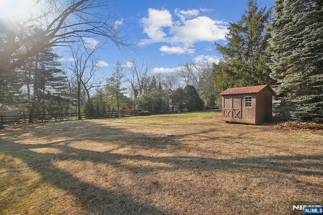 view of yard with a shed and an outbuilding