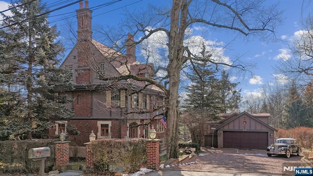 view of front of home with brick siding and driveway