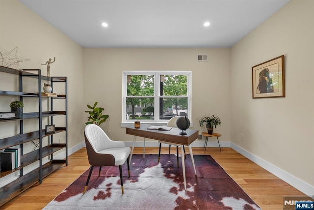 home office featuring wood finished floors, recessed lighting, and baseboards