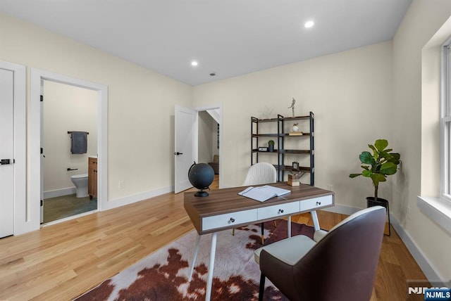 office space featuring wood finished floors, recessed lighting, and baseboards