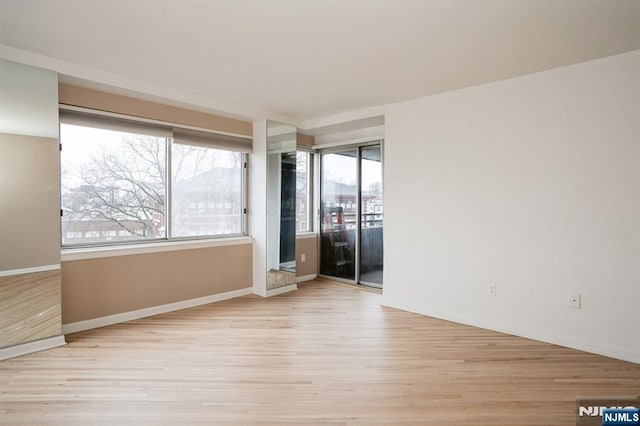 364 Palisade Ave Unit 4C, Cliffside Park, NJ 07010 - spare room featuring wood finished floors and baseboards