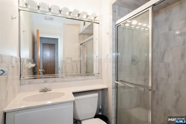 364 Palisade Ave Unit 4C, Cliffside Park, NJ 07010 - full bathroom with vanity, a stall shower, and tile walls