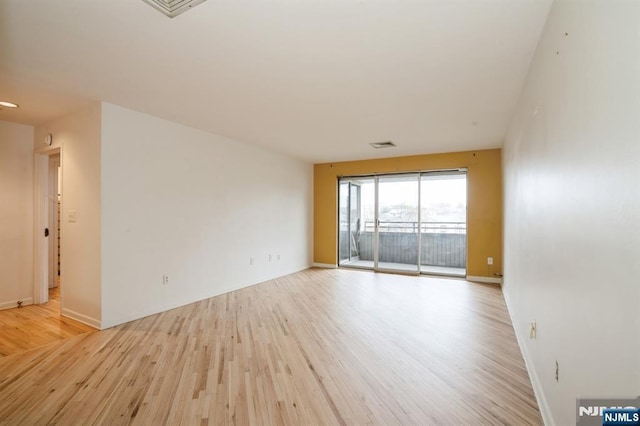 364 Palisade Ave Unit 4C, Cliffside Park, NJ 07010 - spare room with light wood-style flooring and baseboards