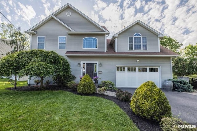 9 Summit Ave, Butler Borough, NJ 07405 - view of front facade featuring asphalt driveway, a front lawn, and a garage