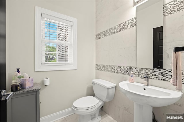 9 Summit Ave, Butler Borough, NJ 07405 - half bath with tile walls, toilet, tile patterned floors, and baseboards