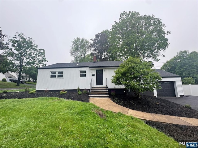 358 Bowden Rd, Cedar Grove, NJ 07009 - view of front of house featuring a garage, asphalt driveway, entry steps, and a chimney