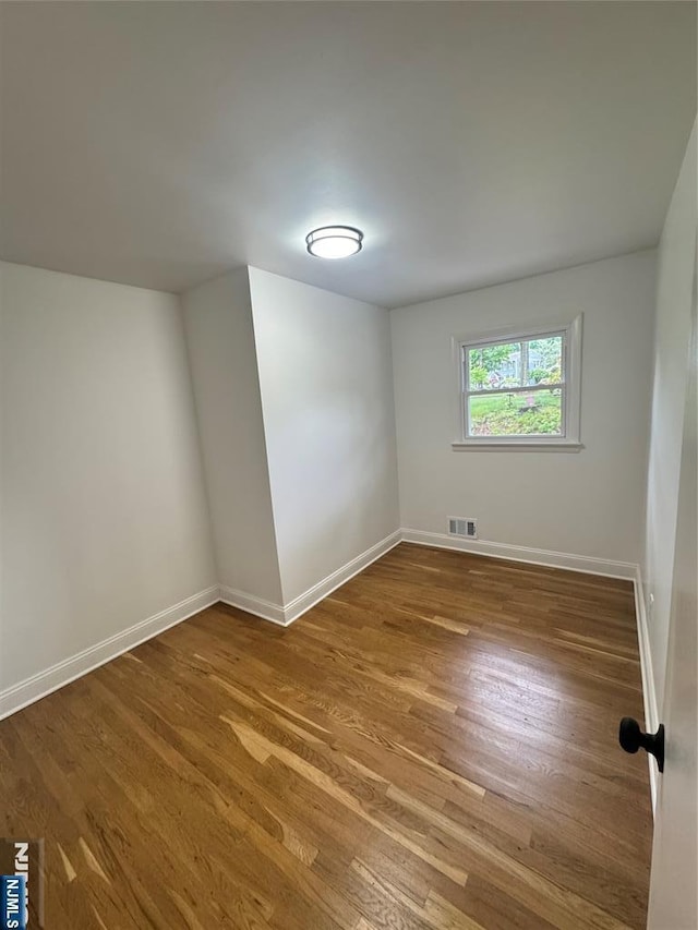 358 Bowden Rd, Cedar Grove, NJ 07009 - empty room with wood finished floors and baseboards