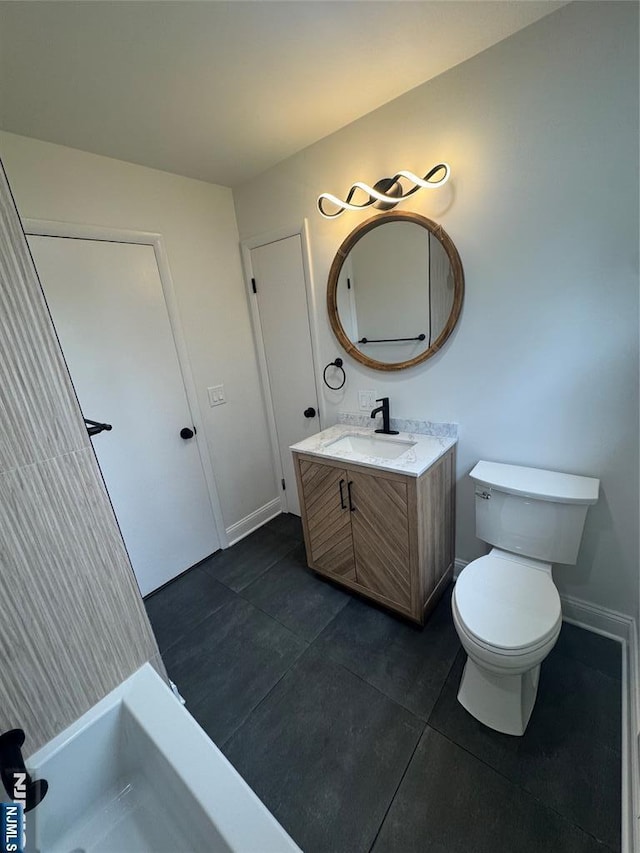 358 Bowden Rd, Cedar Grove, NJ 07009 - bathroom featuring tile patterned flooring, vanity, toilet, and baseboards