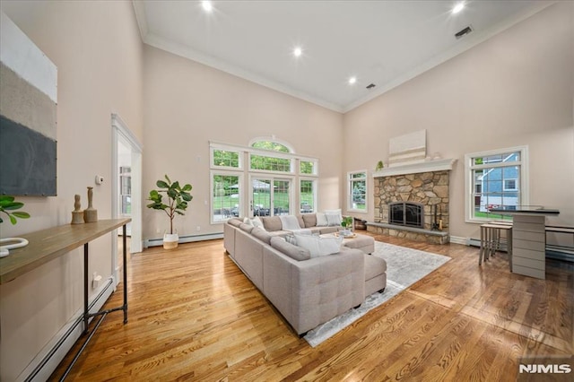 17 Sunset Ln, Upper Saddle River, NJ 07458 - living room with a high ceiling, crown molding, healthy amount of natural light, light wood-style floors, and baseboards