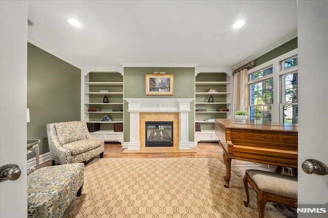 17 Sunset Ln, Upper Saddle River, NJ 07458 - living area featuring ornamental molding, built in shelves, a fireplace, and wood finished floors
