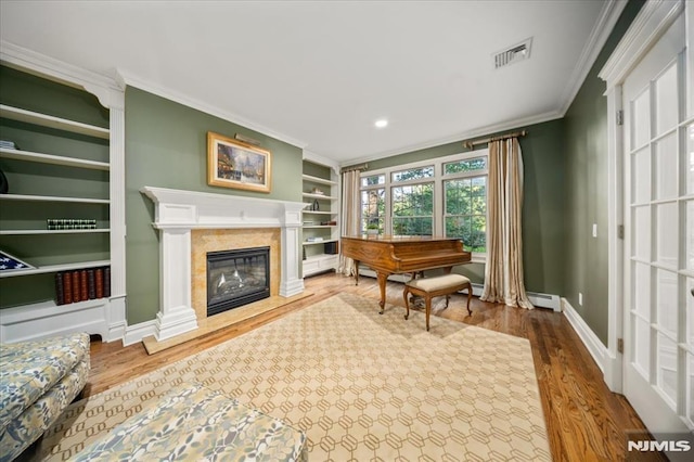 17 Sunset Ln, Upper Saddle River, NJ 07458 - sitting room with crown molding, built in features, wood finished floors, baseboards, and a high end fireplace