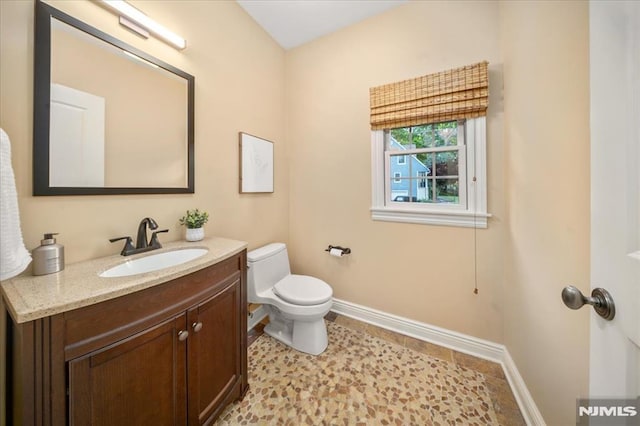 17 Sunset Ln, Upper Saddle River, NJ 07458 - half bathroom featuring toilet, vanity, and baseboards