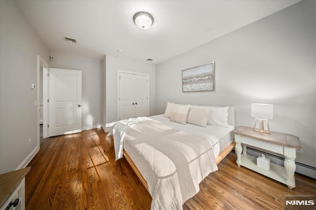 17 Sunset Ln, Upper Saddle River, NJ 07458 - bedroom with wood finished floors, a closet, and baseboards