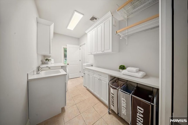 17 Sunset Ln, Upper Saddle River, NJ 07458 - laundry area with light tile patterned floors and a sink