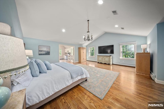 17 Sunset Ln, Upper Saddle River, NJ 07458 - bedroom featuring a baseboard heating unit, vaulted ceiling, a chandelier, baseboard heating, and wood finished floors