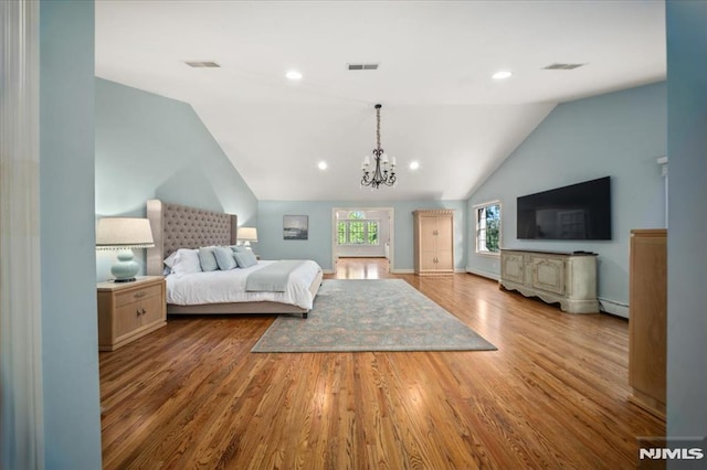 17 Sunset Ln, Upper Saddle River, NJ 07458 - bedroom with vaulted ceiling, a chandelier, wood finished floors, a baseboard heating unit, and baseboards