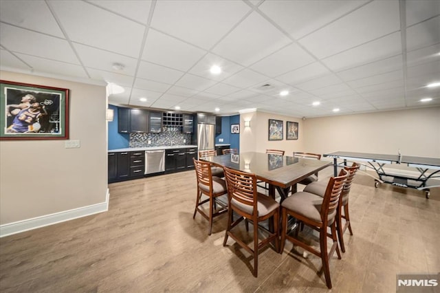 17 Sunset Ln, Upper Saddle River, NJ 07458 - dining area with bar with sink, light wood finished floors, recessed lighting, baseboards, and a drop ceiling