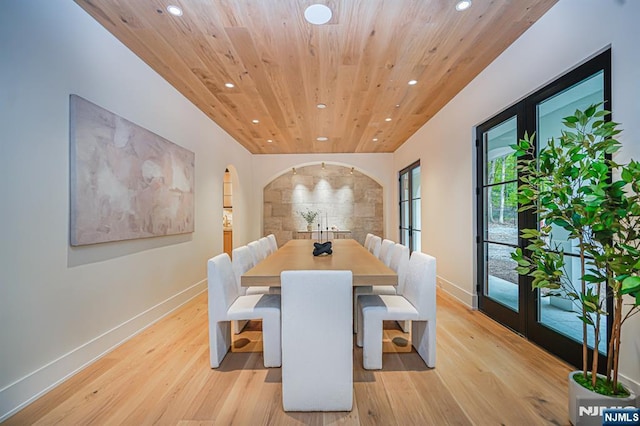 dining room featuring recessed lighting, wood ceiling, baseboards, and light wood-style flooring