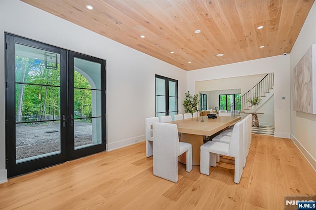 dining space featuring recessed lighting, french doors, light wood-style floors, stairway, and wood ceiling
