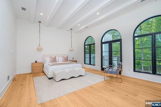 bedroom featuring light wood-style flooring, beam ceiling, baseboards, recessed lighting, and french doors