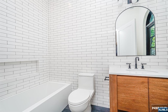 full bath featuring tile walls, vanity, toilet, a tub, and a shower