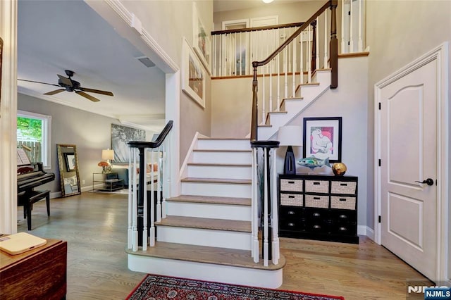 155 W Clinton Ave, Tenafly, NJ 07670 - stairway featuring ceiling fan, wood finished floors, and baseboards