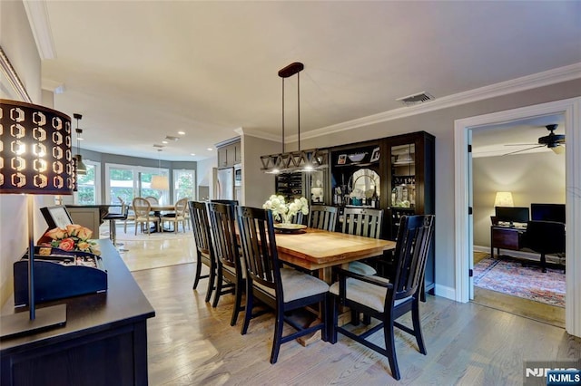155 W Clinton Ave, Tenafly, NJ 07670 - dining space with wood finished floors, crown molding, a ceiling fan, baseboards, and recessed lighting