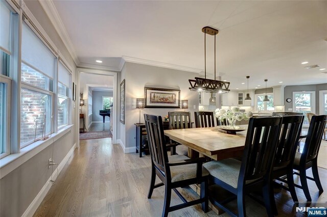 155 W Clinton Ave, Tenafly, NJ 07670 - dining room featuring crown molding, recessed lighting, light wood-style flooring, and baseboards