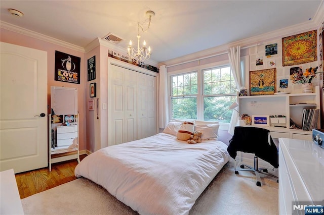 155 W Clinton Ave, Tenafly, NJ 07670 - bedroom featuring crown molding, a chandelier, a closet, and wood finished floors