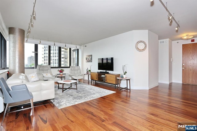 100 Carlyle Dr Unit 10Ds, Cliffside Park, NJ 07010 - living room featuring track lighting, wood finished floors, and baseboards