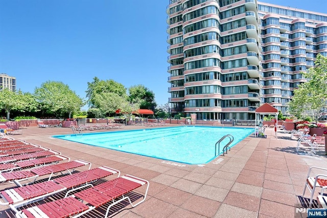 100 Carlyle Dr Unit 10Ds, Cliffside Park, NJ 07010 - community pool with a patio