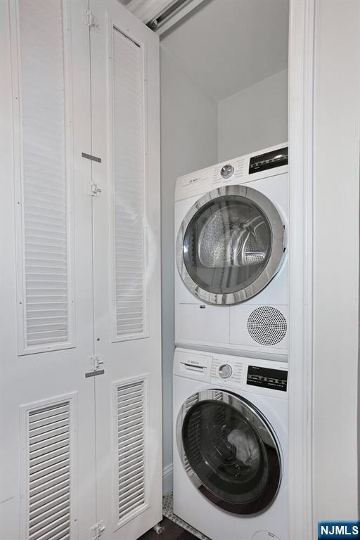 100 Carlyle Dr Unit 10Ds, Cliffside Park, NJ 07010 - washroom with stacked washer / drying machine