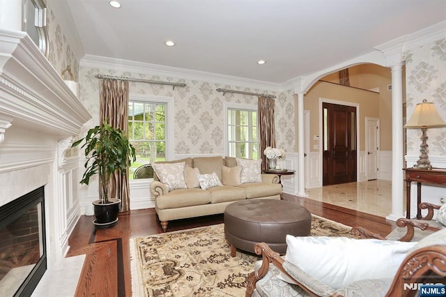 7 Newton Pl, Allendale, NJ 07401 - living area featuring wood finished floors, wallpapered walls, a decorative wall, arched walkways, and ornamental molding