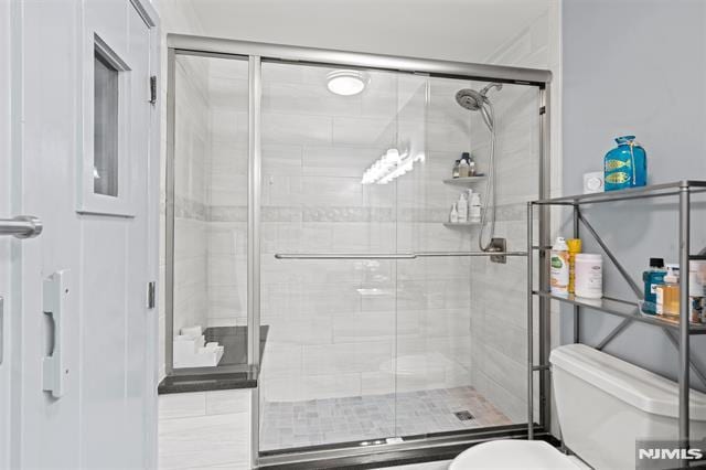 708 Harmon Cv, Secaucus, NJ 07094 - bathroom featuring toilet and a stall shower