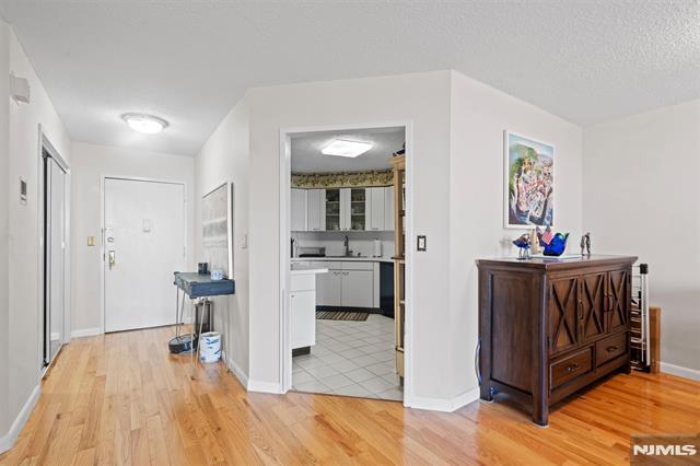 708 Harmon Cv, Secaucus, NJ 07094 - corridor featuring light wood-style flooring and baseboards