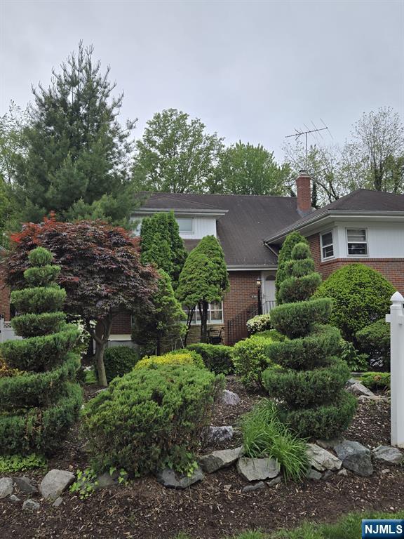 526 Rutland Ave, Teaneck, NJ 07666 - view of front facade featuring brick siding and a chimney