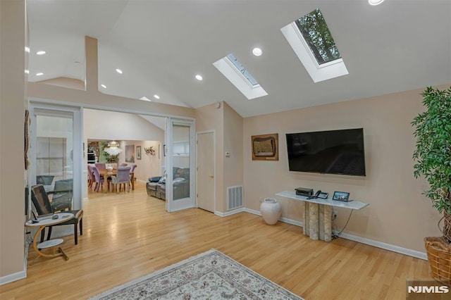 526 Rutland Ave, Teaneck, NJ 07666 - living area featuring a skylight, wood finished floors, vaulted ceiling, baseboards, and recessed lighting