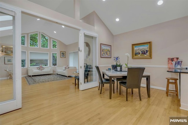 526 Rutland Ave, Teaneck, NJ 07666 - dining area with wood finished floors, high vaulted ceiling, recessed lighting, and baseboards