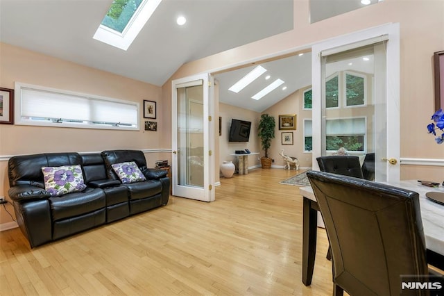526 Rutland Ave, Teaneck, NJ 07666 - living room featuring a skylight, light wood-style flooring, recessed lighting, and high vaulted ceiling