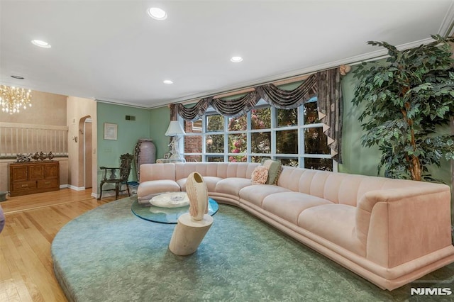526 Rutland Ave, Teaneck, NJ 07666 - living room featuring arched walkways, ornamental molding, wood finished floors, recessed lighting, and baseboards